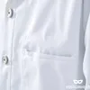 Close-up of a white lab coat pocket and buttons. Produktbild-Vorschau