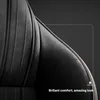 A close-up view of the stitching and edge trim of a black chair. Produktbild-Vorschau