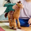 A child's hands holding a toy horse, with pillows and a blanket in the background. Podgląd zdjęcia produktu