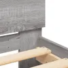 Close-up view of a bed frame with wooden slats. Voir les images du produit