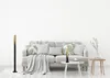 A living room scene with a sofa, floor lamp, and side table. Anteprima dell’immagine prodotto