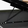 A close-up view of the gas spring mechanism of a bed frame. Produktbild-Vorschau