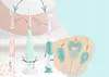 A collage of electric toothbrushes and their attachments, with graphic elements indicating usage. Produktbild-Vorschau