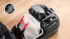 Close-up view of the interior of a Bosch vacuum cleaner, showing a dust bag, filter, and some accessories. Anteprima dell’immagine prodotto