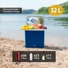 A blue cooler box filled with fruits and drinks on a sandy beach by a lake. Náhled obrázku produktu