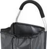 Close-up of the top of a gray shopping trolley bag with a drawstring closure and a silver handle with a black grip. Produktbild-Vorschau