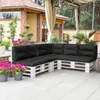 An outdoor patio area with a sectional sofa made from white-painted wooden pallets and black cushions. Anteprima dell’immagine prodotto