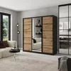 A modern bedroom or living room setting featuring a large sliding door wardrobe with wood-effect panels and mirrored sections. Produktbild-Vorschau