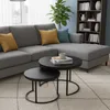 A living room scene with a sectional sofa, coffee tables, and a bookshelf. Voir les images du produit