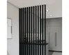 A modern interior with a black slatted room divider. Náhled obrázku produktu