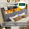 A close-up view of a bed headboard with integrated shelving and charging ports, showcasing its features. Produktbild-Vorschau