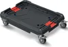A black and red transport trolley with wheels, shown from a slightly elevated diagonal angle against a white background. Náhled obrázku produktu