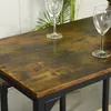 A close-up view of a wooden table with two wine glasses on it. Náhled obrázku produktu