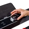 A hand is shown interacting with a control dial on a treadmill's display. Produktbild-Vorschau