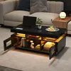 A modern black coffee table with LED lighting is placed in a living room setting next to a sofa. Náhled obrázku produktu
