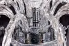 A close-up view of the intricate details of a crystal chandelier. Náhled obrázku produktu