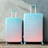 Two suitcases of different sizes placed next to each other against a textured wall. Náhľad obrázku produktu