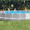 A family is enjoying a day at their backyard swimming pool. Produktbild-Vorschau