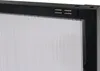 A close-up view of the top corner of a black framed cabinet with a white ribbed interior. Podgląd zdjęcia produktu