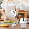 A person is using a kitchen appliance to chop vegetables, with the product prominently displayed. Produktbild-Vorschau