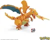 A LEGO-style Charizard figure with a flame attack, next to a Pokeball. Voir les images du produit