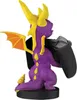 A purple dragon figurine holding a black video game controller. Náhled obrázku produktu
