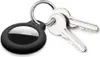A black Apple AirTag case with two silver keys attached to a silver keyring, all on a white background. Produktbild-Vorschau