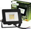 A black LED floodlight is shown in the foreground, with its packaging in the background. The packaging displays product information and branding. Produktbild-Vorschau