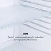 Close-up of a shelf with clear, flexible inserts inside an appliance. Podgląd zdjęcia produktu