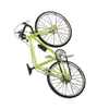 A miniature green bicycle ornament is shown against a white background. Produktbild-Vorschau