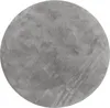 A circular rug with a textured, plush surface. Anteprima dell’immagine prodotto