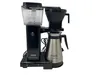 A black and silver Moccacoffee maker with a thermal carafe is shown against a white background. Produktbild-Vorschau