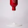 A red bottle of Wella Professionals shampoo is shown with shampoo pouring out onto a white surface. Anteprima dell’immagine prodotto