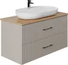 A modern bathroom vanity with a sink and faucet. Produktbild-Vorschau