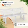 A white plastic garden bench is shown in an outdoor setting with greenery and marketing text. Náhled obrázku produktu