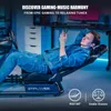A man is relaxing in a gaming chair while holding a phone, with a gaming setup in the background. Produktbild-Vorschau