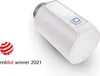 A smart home heating thermostat with a digital display and a red dot award logo. Produktbild-Vorschau