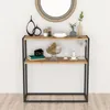 A console table with decorative items on it, set against a white wall. Náhled obrázku produktu