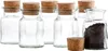 A group of empty glass jars with cork stoppers, and one jar filled with dark peppercorns. Produktbild-Vorschau