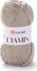 A ball of beige yarn with a white label. Podgląd zdjęcia produktu