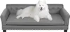 A white dog is lying on a gray pet sofa. Voir les images du produit