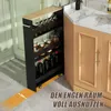 A narrow rolling cart filled with jars and bottles is placed next to a kitchen cabinet. Podgląd zdjęcia produktu