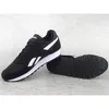 A pair of black Reebok sports shoes with white accents are displayed on a textured gray surface. Produktbild-Vorschau