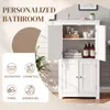 A white bathroom cabinet with its doors open, displaying toiletries and towels. The left side of the image has marketing text and icons. Produktbild-Vorschau