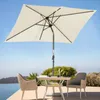 An outdoor patio scene with a table, chairs, and a large umbrella. Produktbild-Vorschau