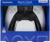 The product is a PlayStation PS5 controller alarm clock displayed in its retail packaging. Náhled obrázku produktu