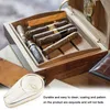 A cigar humidor filled with cigars and a small ashtray in the foreground. Produktbild-Vorschau