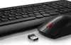 A black wireless keyboard and mouse set with a USB dongle on a white background. Produktbild-Vorschau