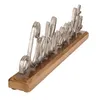 A silver-colored metal script-style word art spelling 'Lieblingsplatz' (German for 'favorite place') mounted on a wooden base. Produktbild-Vorschau