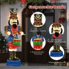 A large illuminated nutcracker figure with drums, displayed outdoors in front of a doorway, with promotional text and close-up images of its features. Podgląd zdjęcia produktu
